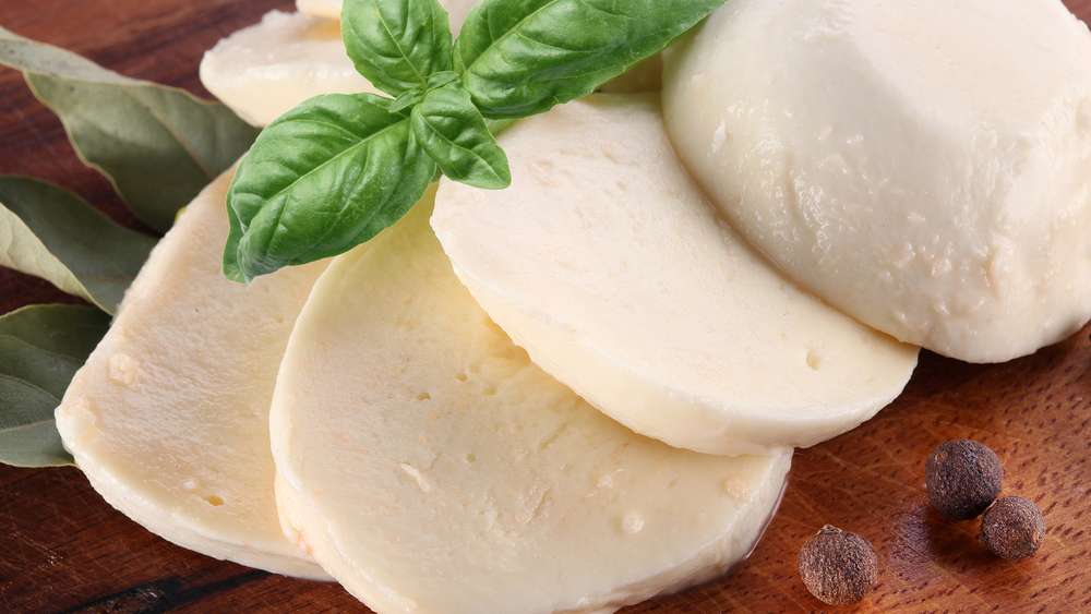 Mozzarella-cheese-and-basil-on-a-wooden-board-
